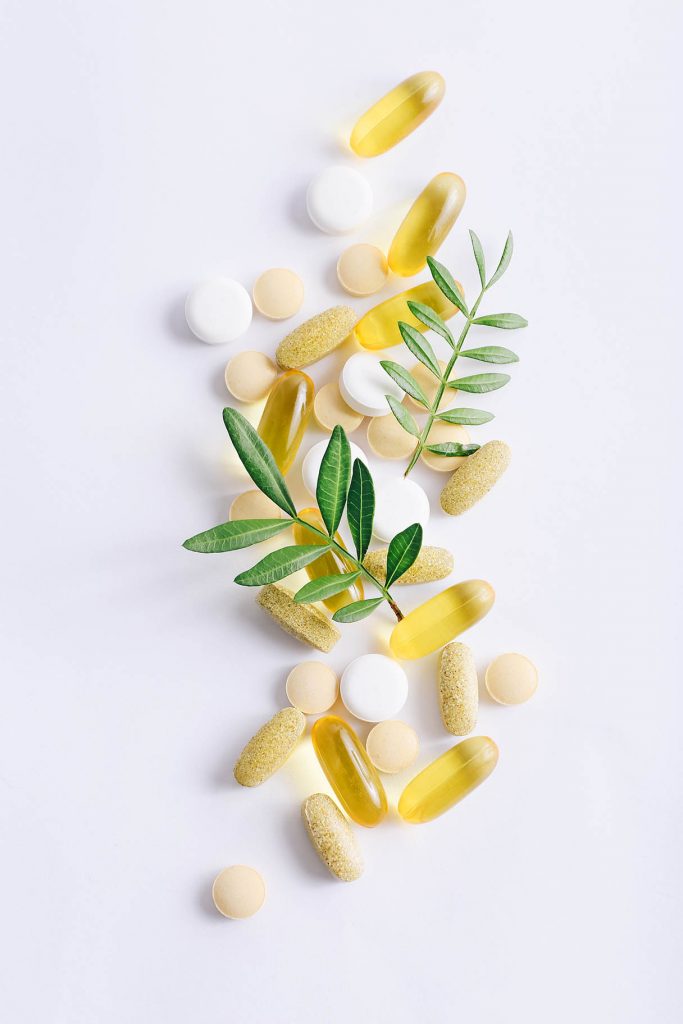 Assorted natural health products, medicine pills, tablets and capsules on a white background, Natural Health Products licensing consultants get approved fast, pharmaceutical medicine pills, tablets and capsules on a white background