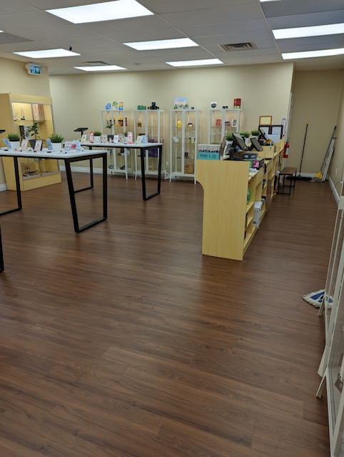 Sales floor of a cannabis retail store showing display cases