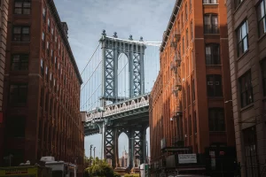 Image of bridge between two brick buildings in New York City