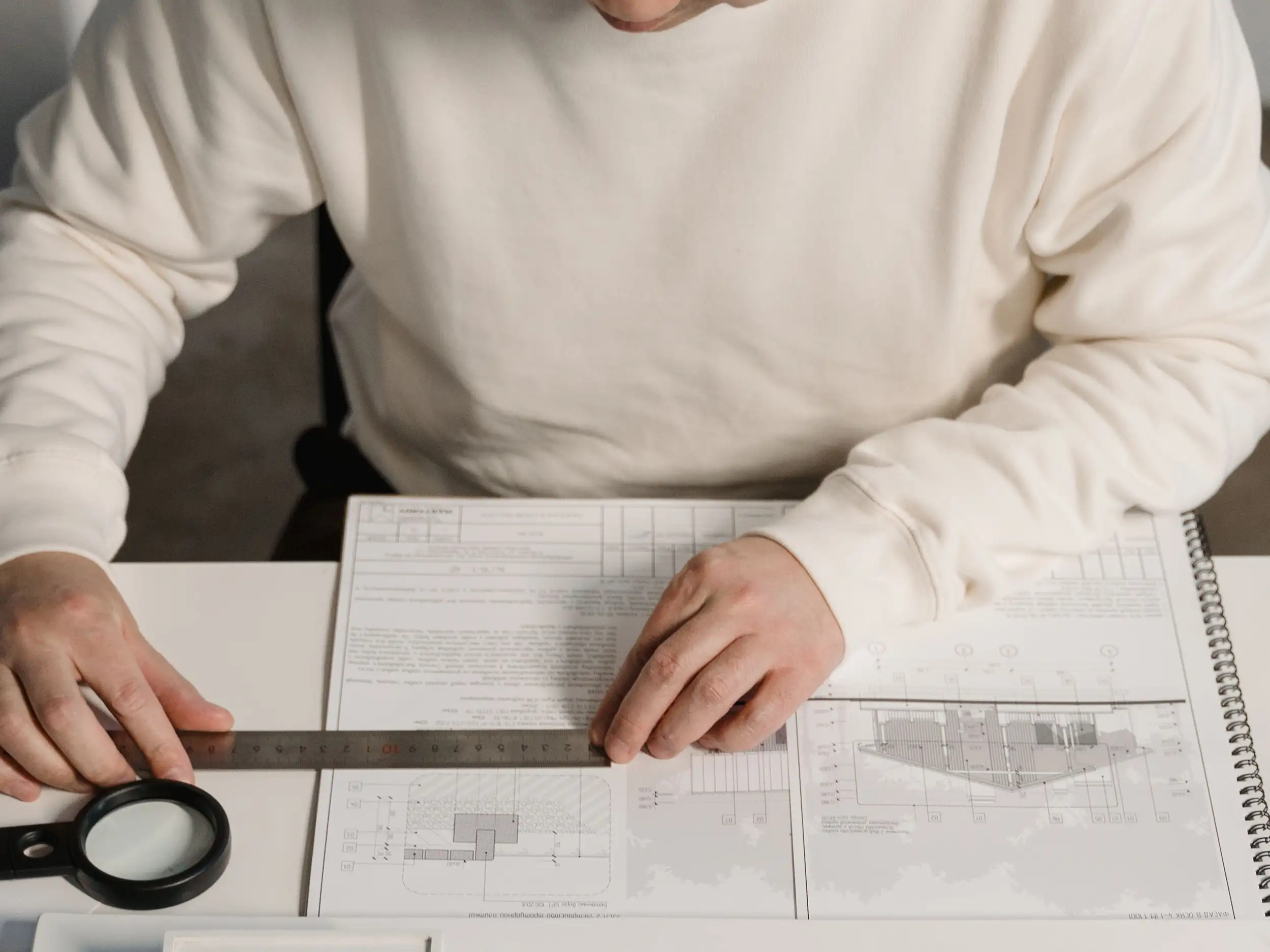 Regulatory compliance consultant conducting a blueprint and floor plan review for a commercial cannabis facility.
